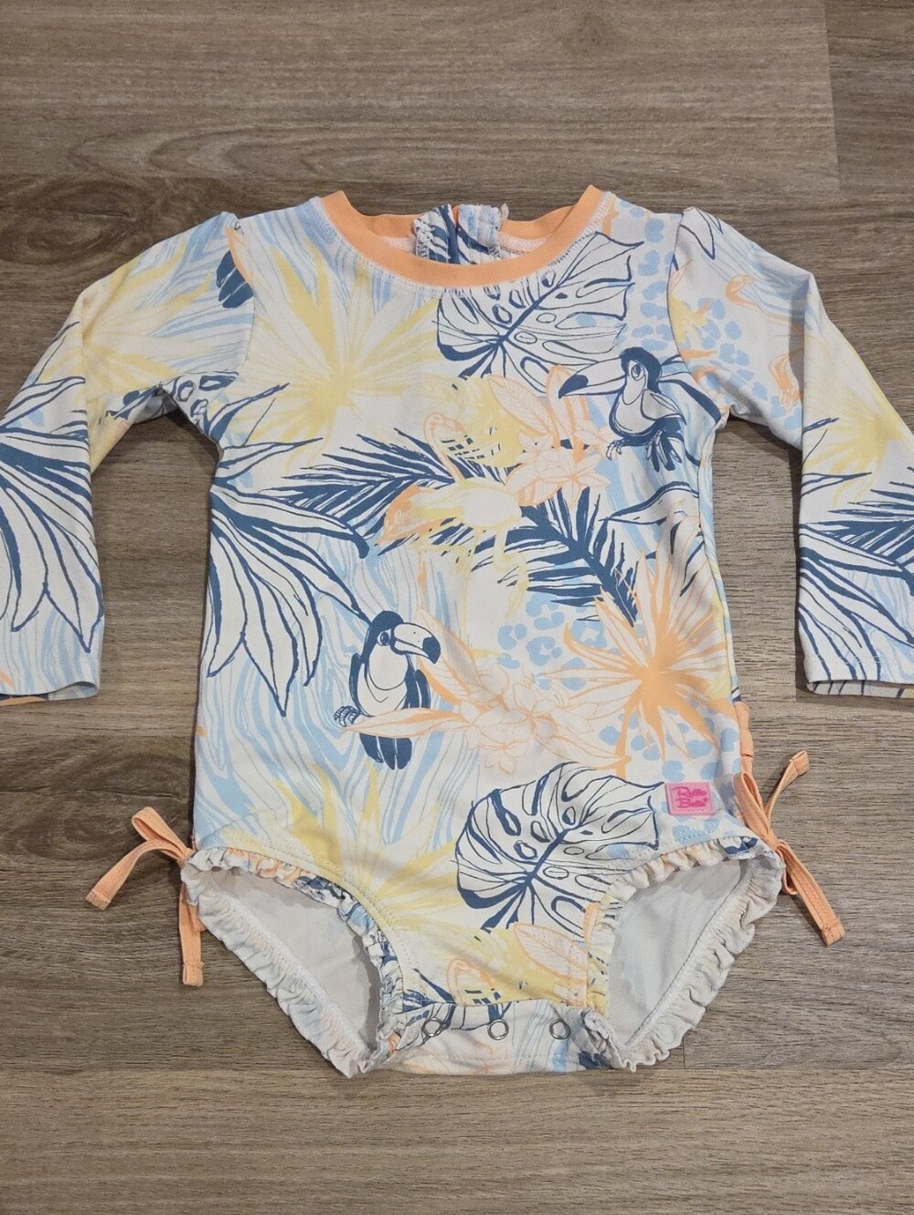 Ruffle Butts Tropical Toucan Long-Sleeve One-Piece -Peach, Blue & Yellow Size 2t